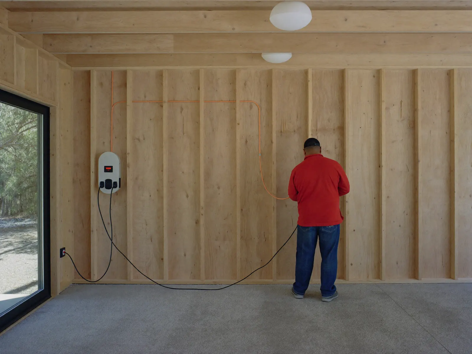 Electrician prewiring an EV charger circuit in an Adelaide new-build garage